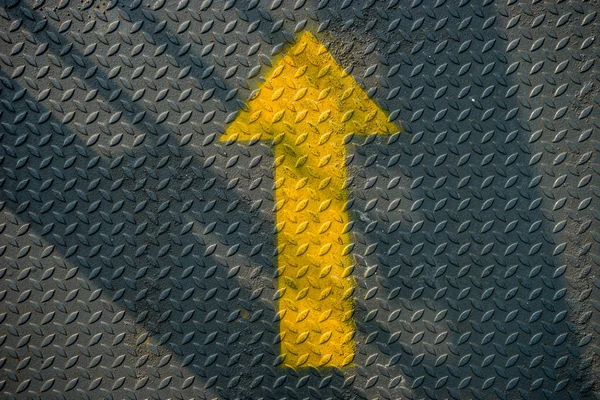 Yellow up arrow and steel background