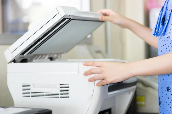 Woman's hand with working Photocopy — Stock Photo, Image