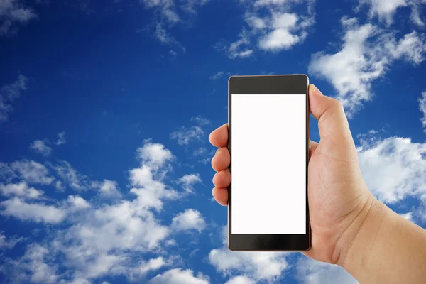 Hand holds smartphone with cut out screen and sky on background — Stock Photo, Image