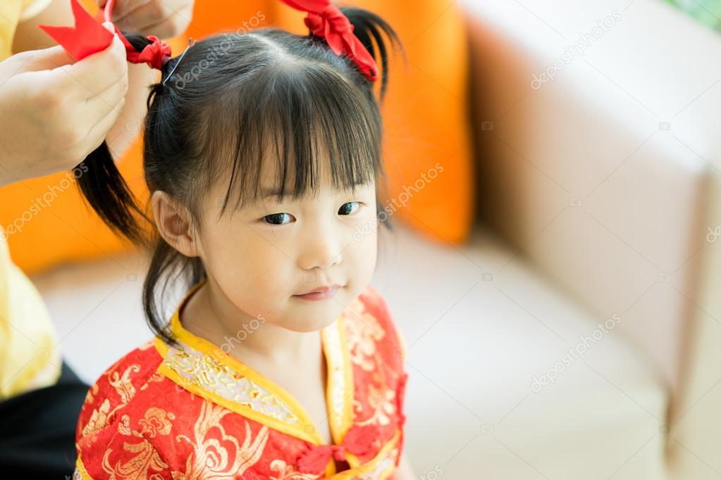 Cute Asian Little Girl Wearing Red Traditional Chinese Suit