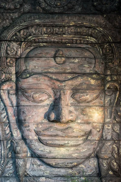 Gesicht eines handgefertigten Buddha-Holzes — Stockfoto