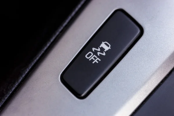 Botón resbaladizo. Una imagen de un botón para el control de tracción en un coche moderno Imagen De Stock