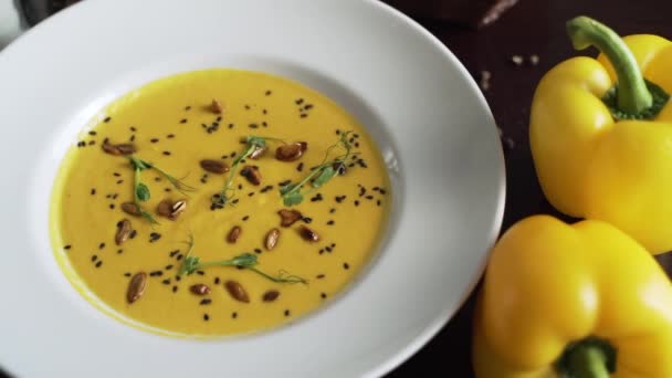 Yellow vegetable pureed soup in a white plate — Stock Footage Yellow Vegetable Pureed Soup White Plate Stock Footage