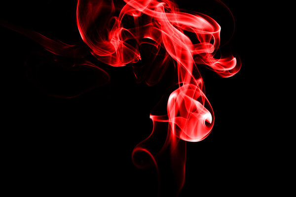 Abstract red smoke on black background from the incense sticks