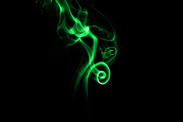 Abstract green smoke on black background Stock Image