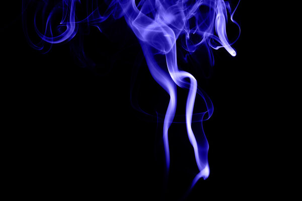 Abstract blue smoke on black background from the incense sticks