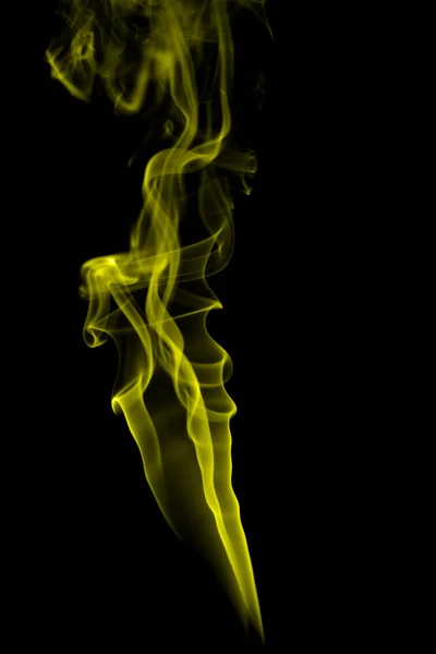 Humo amarillo abstracto sobre fondo negro —  Fotos de Stock