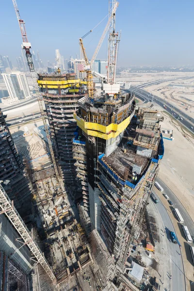 United Arab Emirates, Dubai, 05/21/2015, Damac Towers Dubai by Paramount, construction and building ariel views with cityscape background