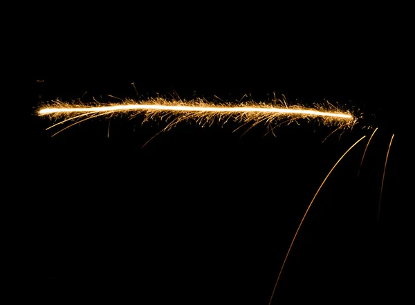 Sparkler light trail in dark environment using slow shutter speed — Stock Photo, Image