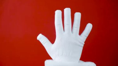 Fucking 2020 year. The concept of a bad new year or christmas. Harsh emotion painted on the middle finger of Santa hand