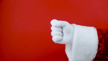 Eller Eğitime Sayım Seti. Beyaz eldivenli Noel Baba El kırmızı arka planda birden beşe kadar el kol hareketi yapıyor. 1 numara sayılıyor.