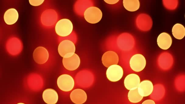 Abstract blurred bokeh lights on red background. Christmas and new year holidays light — Stock Video