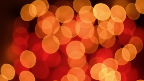 Абстрактні розмиті боке на червоному тлі. Різдвяні та новорічні свята світло — стокове відео