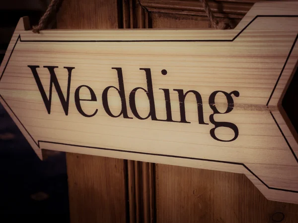 Wedding arrow hanging on door — Stock Photo, Image