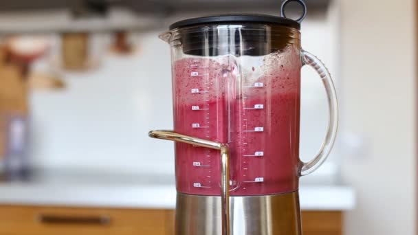 Berry banana smoothie being mixed in blender — Stock Video