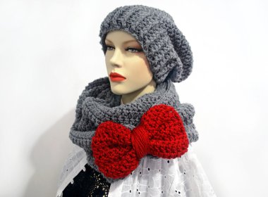 doll wearing a crochet grey scarf and a beanie clipart