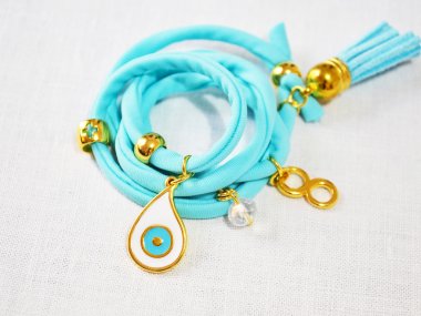 still life of a turquoise bracelet clipart