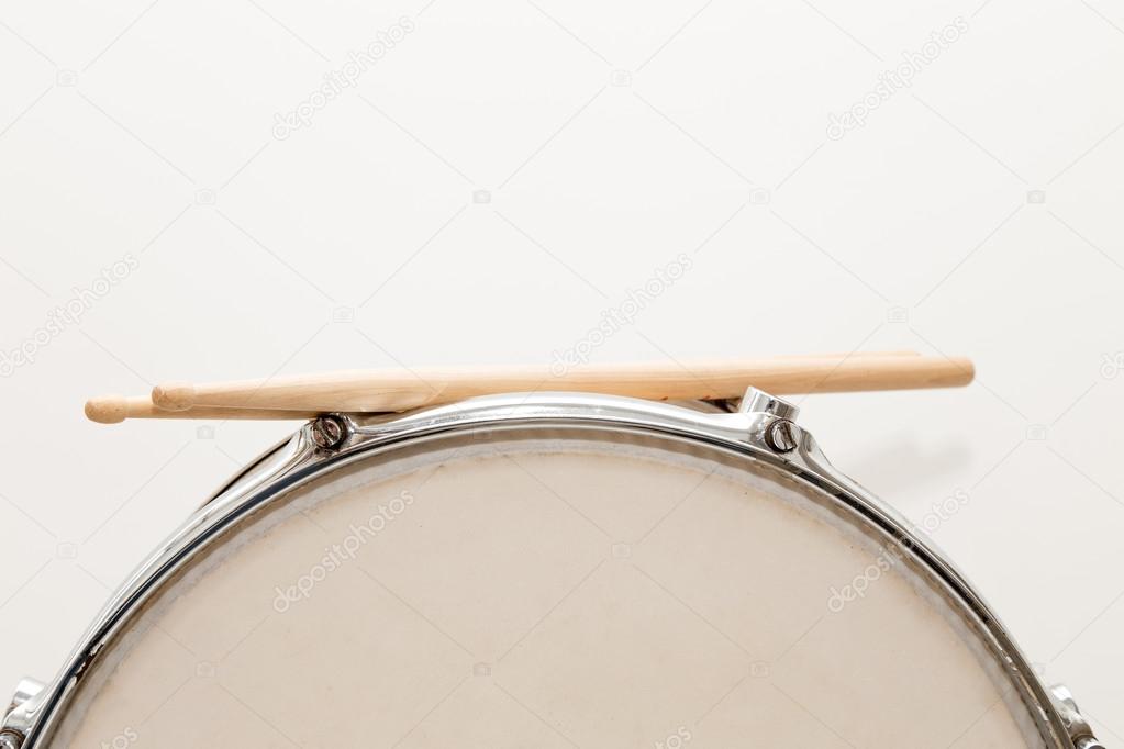 Wood snare drum and drumsticks isolated