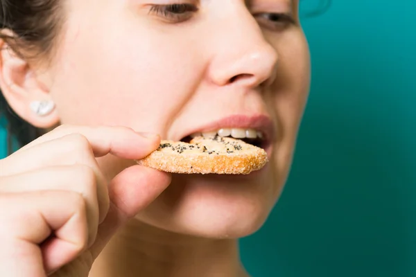 beautiful brunette girl eat cookie