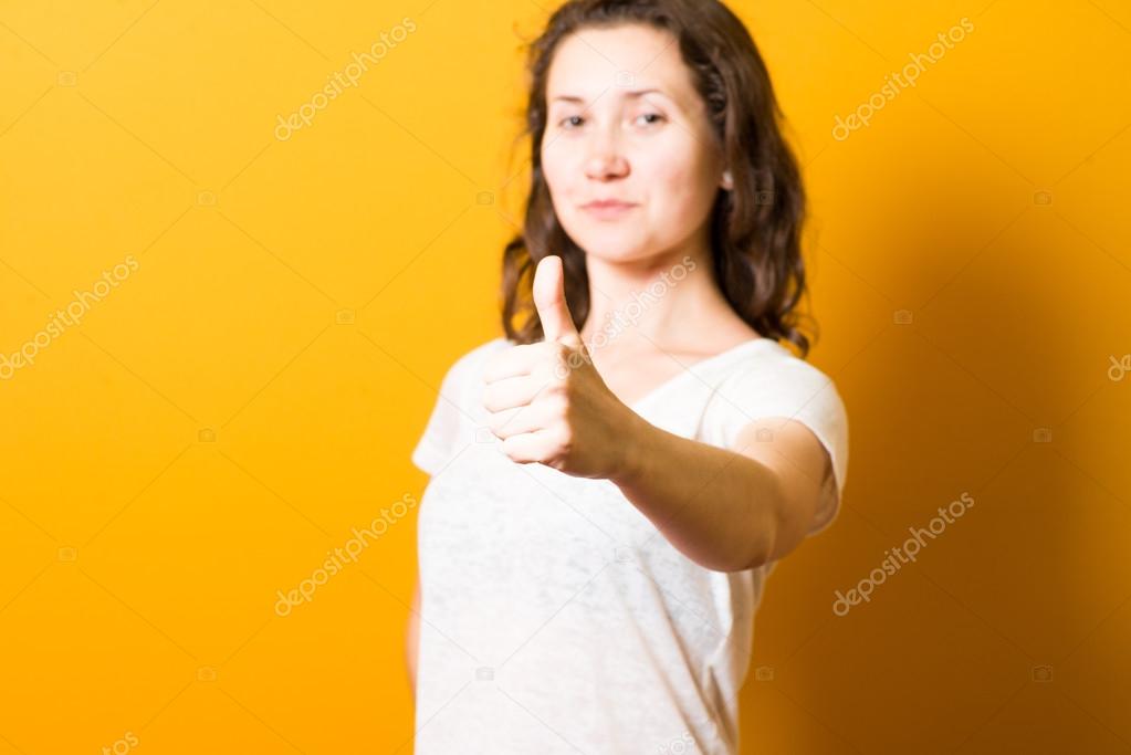 Girl showing thumbs up, everything is super cool