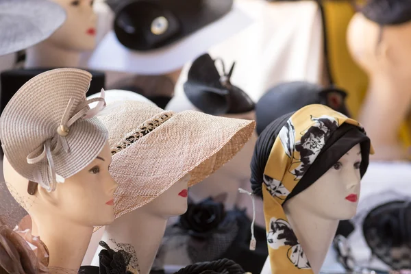 Female hats on sale in a street market