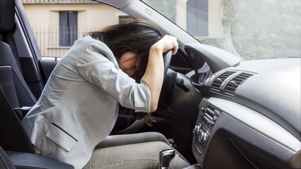 Unhappy woman in his car — Stock Photo, Image