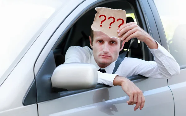 Unhappy driver in his car asking for help — Stock Photo, Image