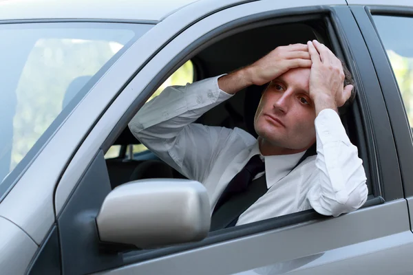 Unhappy driver in his car — Stock Photo, Image