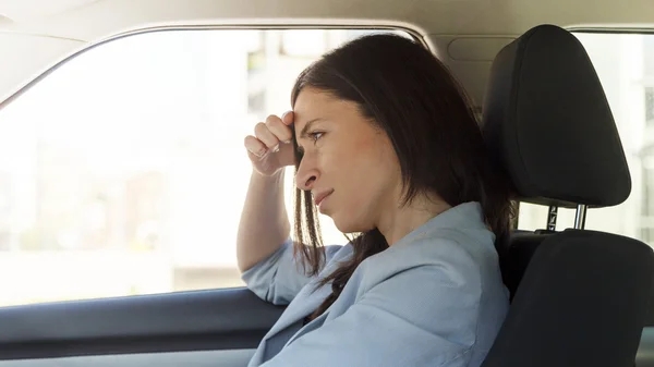 Angry woman in her car — Stock Photo, Image