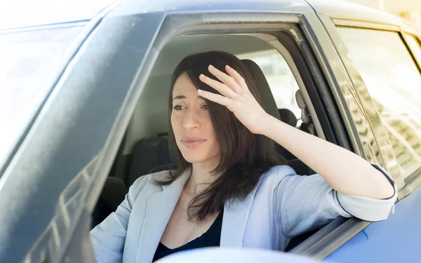 Angry woman in her car — Stock Photo, Image