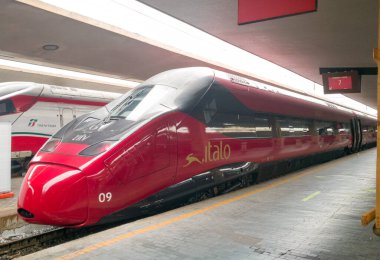 FLORENCE, ITALY - FEBRUARY 16 2021: High speed Italo train ready to leave. This is one of the fastest trains in the world. clipart