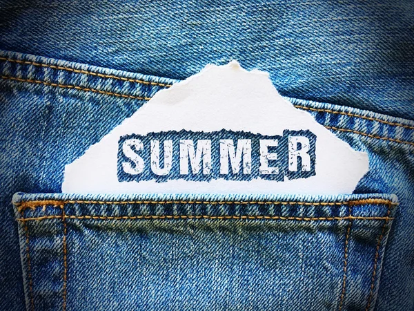 Summer word on white paper in the pocket of blue denim jeans — Stock Photo, Image