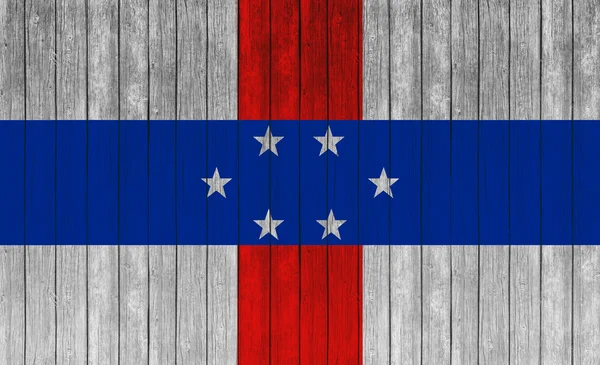 Netherlands Antilles flag on old wood texture background