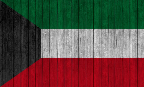 Kuwait flag on grungy wood plank backgroun