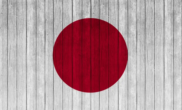 japanese flag on wood texture background