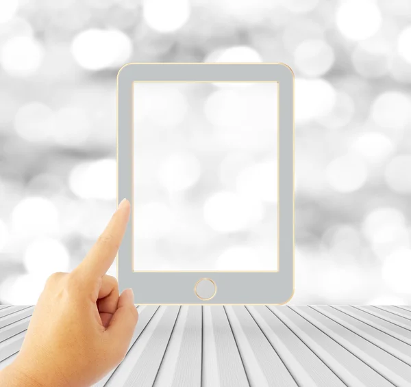 woman hand touch tablet over blurred bokeh background