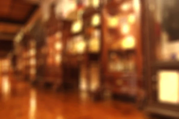 blurry defocused image of furniture shop for background
