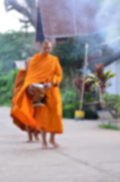 Abstract blur background the monk was walking on the overpass.