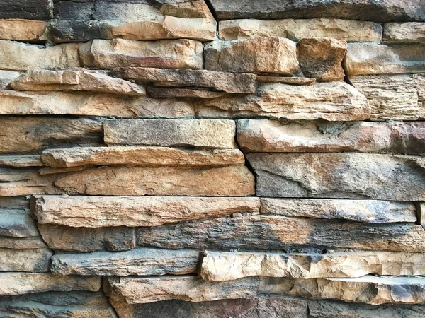 Нерівномірний тріснутий фон текстури кам'яної стіни — стокове фото