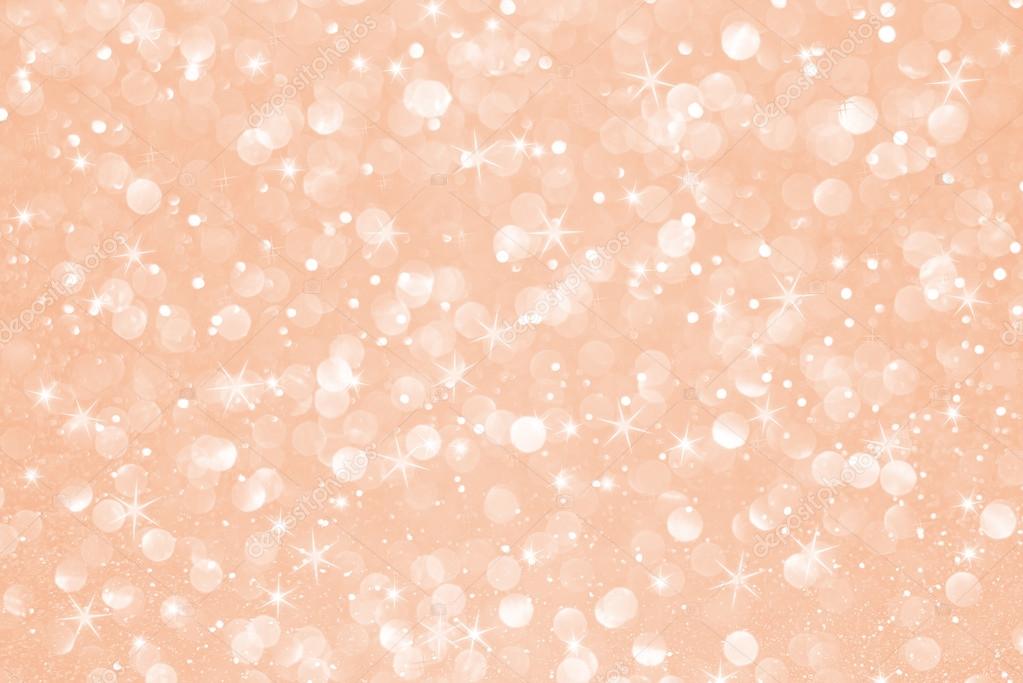 Rose gold glitter bokeh with stars abstract background