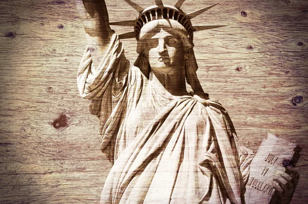 Statue of Liberty, wooden textured background — Stock Photo, Image