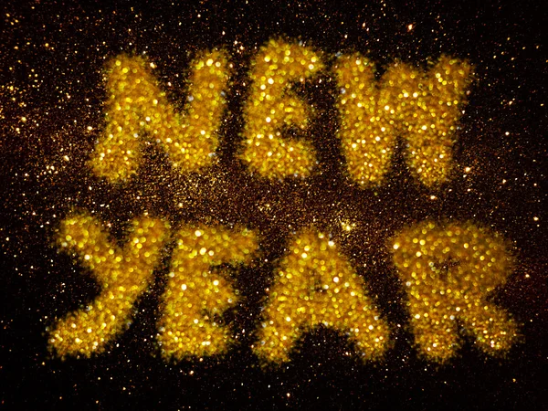 Guld glitter abstrakt bakgrund med ordet nyår — Stockfoto
