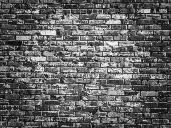 Oude grijze vintage bakstenen muur textuur achtergrond met donkere vigne — Stockfoto