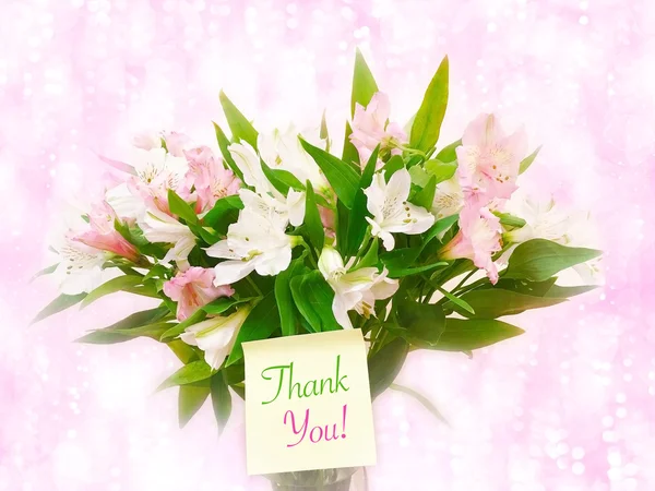 Bouquet of pink and white flowers on pink glitter bokeh backgrou