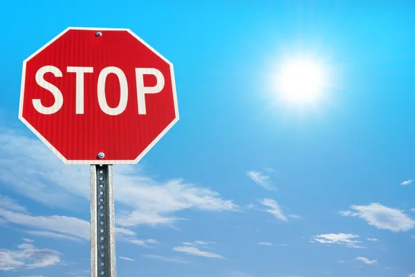 Stop sign on blue sky background — Stok fotoğraf