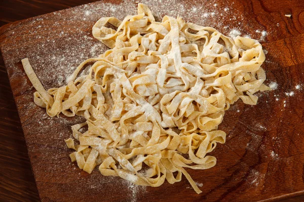 Fresh pasta on board — Stock Photo, Image