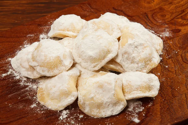 Tortellini on a wooden table — Stock Photo, Image