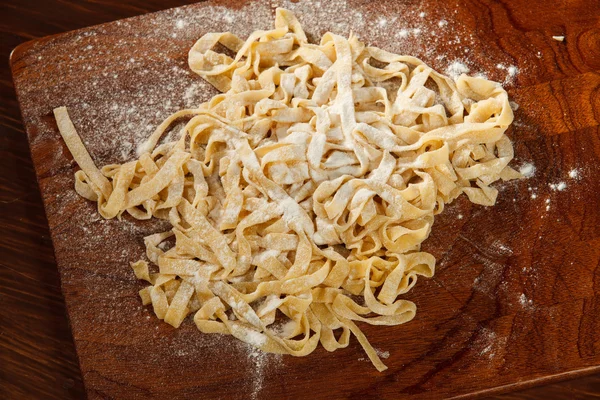 Fresh pasta on board — Stock Photo, Image