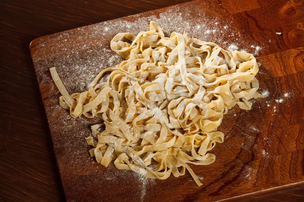 Fresh pasta on board — Stock Photo, Image