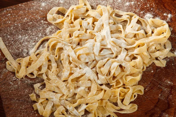 Fresh pasta on board — Stock Photo, Image